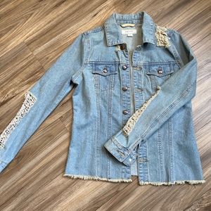 Denim jacket with ripped markings